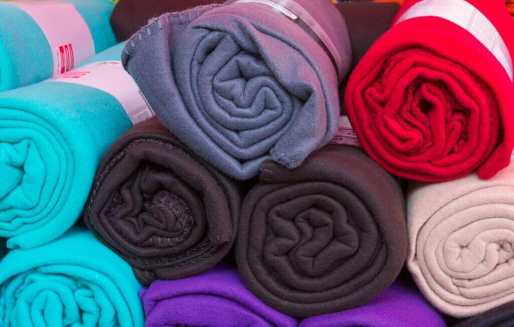 Rolled colorful fleece blankets