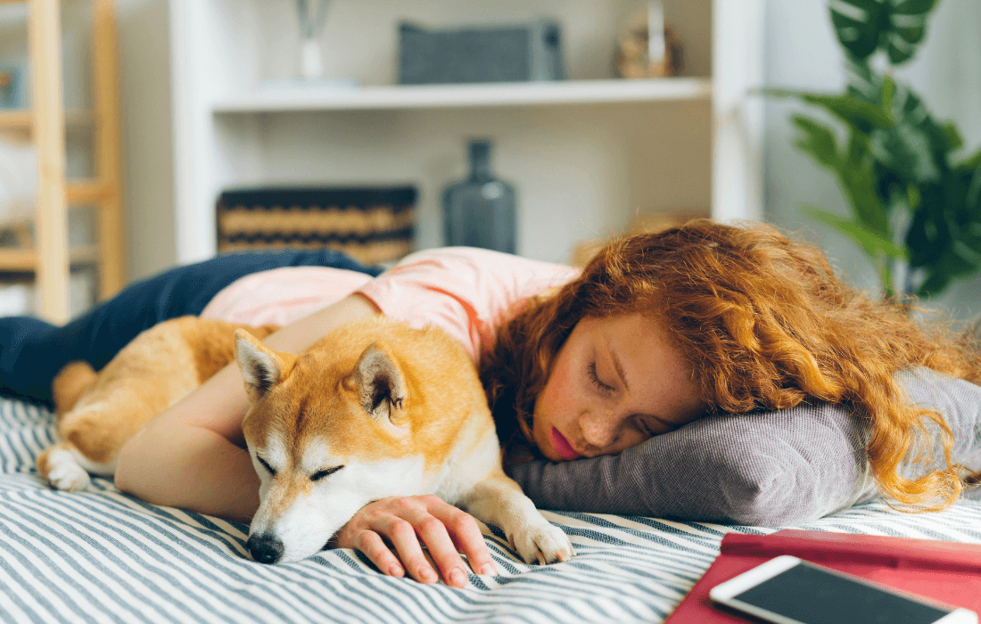 Redhead Woman Sleeping with Dog