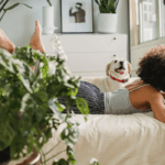 black woman with dog and laptop