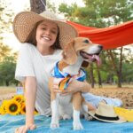 dog mom with Beagle Dog on Picnic in Forest