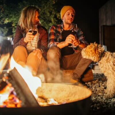 Couple enjoying glamping with dog