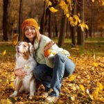 fall scene with a healthy dog with owner outdoors,