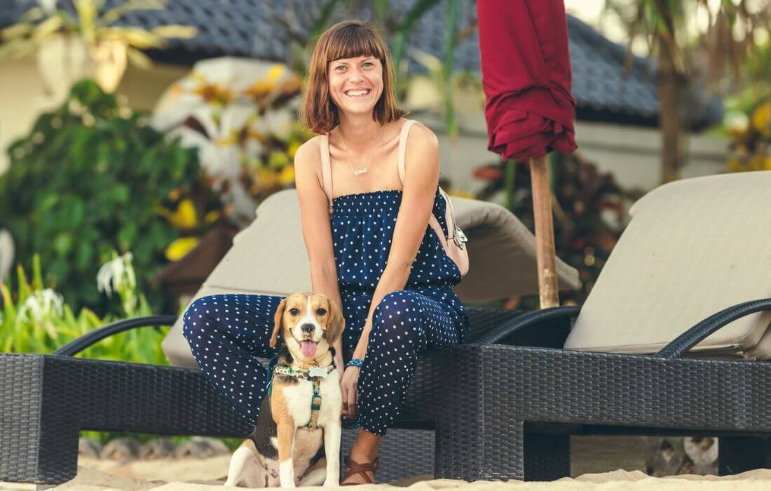 woman with dog in a glamping resort